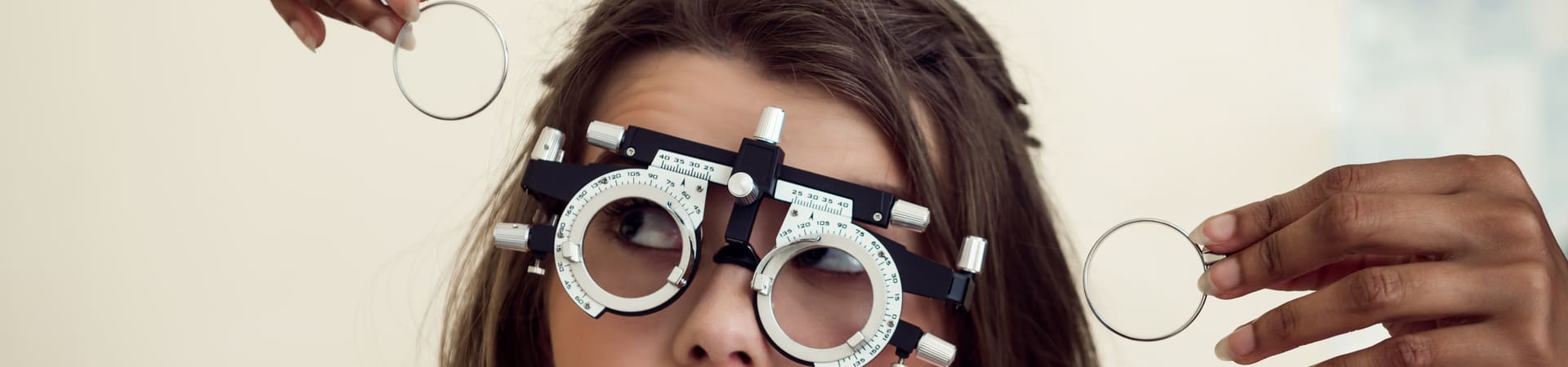 Patient being fitted with optometric trial frames